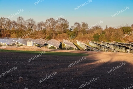 Generating clean energy with solar modules in a big park in northern Europe.