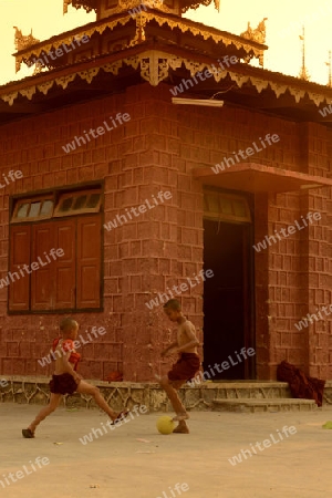 Young Monks Play Soccer in a Pagoda in the town of Nyaungshwe at the Inle Lake in the Shan State in the east of Myanmar in Southeastasia.