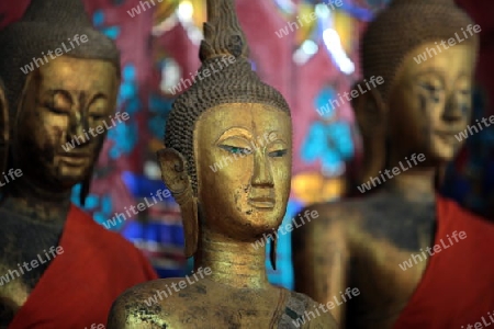 Buddhafiguren in einem der Tempel Xieng Thong in der Altstadt von Luang Prabang in Zentrallaos von Laos in Suedostasien