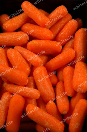 Baby Carrots on Black Vertical