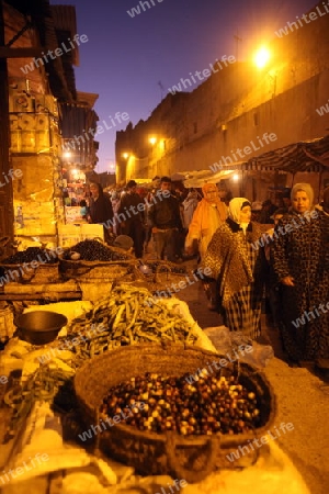 a smal Marketroad in the Medina of old City in the historical Town of Fes in Morocco in north Africa.