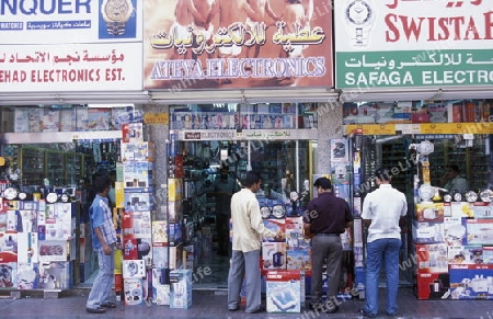 a shopping street in the souq or Market in the old town in the city of Dubai in the Arab Emirates in the Gulf of Arabia.