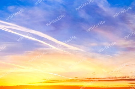 Beautiful high resolution panorama of orange and red sunset clouds in the evening sky.