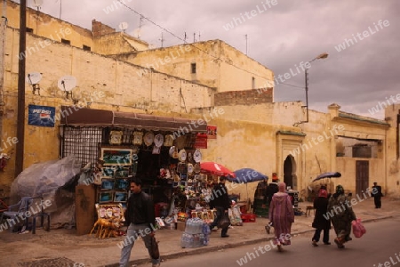 a shop in the Marketroad in the Medina of old City in the historical Town of Fes in Morocco in north Africa.