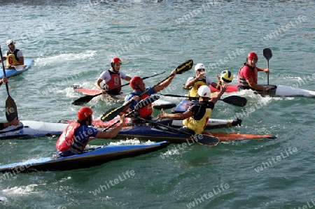 a Water Kanu Ball Game in the Harbour in the old town of Siracusa in Sicily in south Italy in Europe.