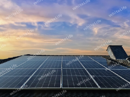 Solar panels producing clean energy on a roof of a residential house