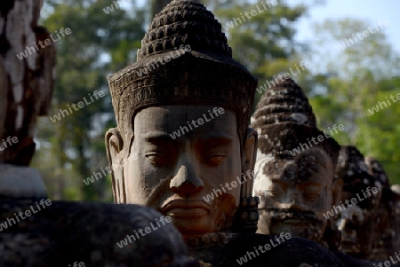 The Angkor Tom Gate in the Temple City of Angkor near the City of Siem Riep in the west of Cambodia.