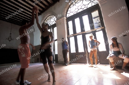 a Salsa Dance school in the city centre in the city of Santiago de Cuba on Cuba in the caribbean sea.