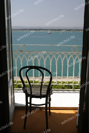 a Balcony an the seaside in the old Town of Siracusa in Sicily in south Italy in Europe.