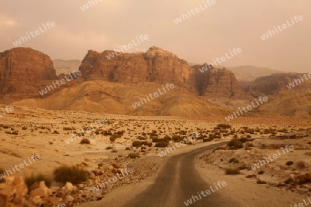 A flat tire on a Taxi on the Desertroad 65 near the Towns Safi and Aqaba in Jordan in the middle east.