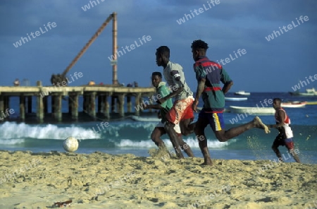 People play soccer the Beach of Santa Maria on the Island of Sal on Cape Verde in the Atlantic Ocean in Africa.