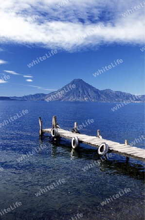 The Lake Atitlan mit the Volcanos of Toliman and San Pedro in the back at the Town of Panajachel in Guatemala in central America.   