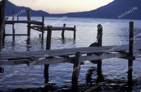 The Lake Atitlan mit the Volcanos of Toliman and San Pedro in the back at the Town of Panajachel in Guatemala in central America.   