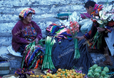 people in traditional clotes at the Market in the Village of  Chichi or Chichicastenango in Guatemala in central America.   