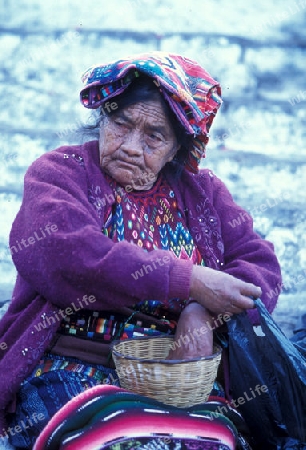 people in traditional clotes at the Market in the Village of  Chichi or Chichicastenango in Guatemala in central America.   