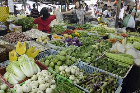 the food market at the Maeklong Railway Markt at the Maeklong railway station  near the city of Bangkok in Thailand in Suedostasien.