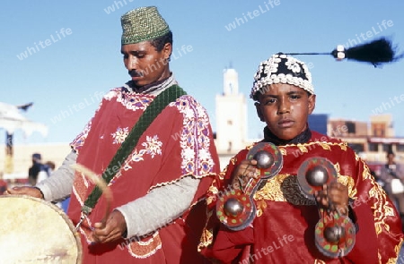 Traditional Music player at the Djemma del Fna Square in the old town of Marrakesh in Morocco in North Africa.
