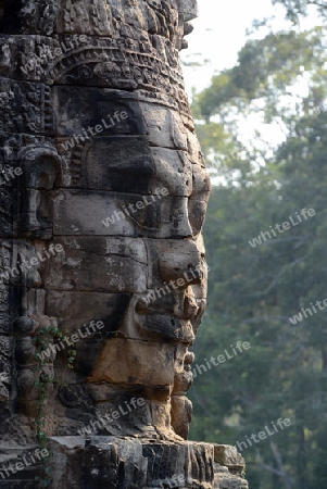 Stone Faces the Tempel Ruin of Angkor Thom in the Temple City of Angkor near the City of Siem Riep in the west of Cambodia.