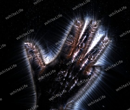 3D-Illustration of a glowing human female hand with a kirlian aura showing different symbols.