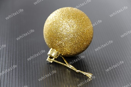 golden xmas ball with black background