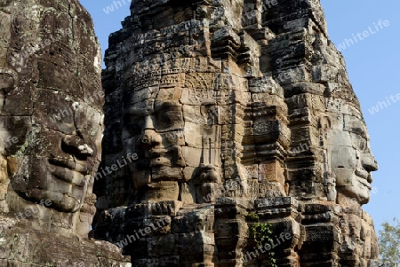 Stone Faces the Tempel Ruin of Angkor Thom in the Temple City of Angkor near the City of Siem Riep in the west of Cambodia.