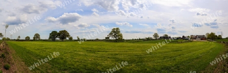 Beautiful high resolution panorama of a landscape with fields and green grass found in Denmark and Germany