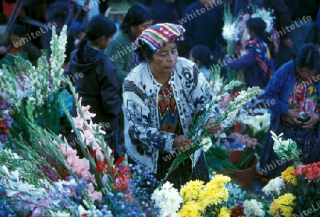 people in traditional clotes at the Market in the Village of  Chichi or Chichicastenango in Guatemala in central America.   