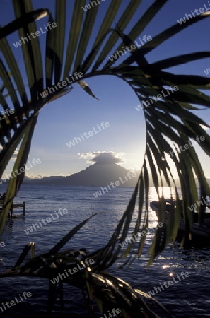 The Lake Atitlan mit the Volcanos of Toliman and San Pedro in the back at the Town of Panajachel in Guatemala in central America.   