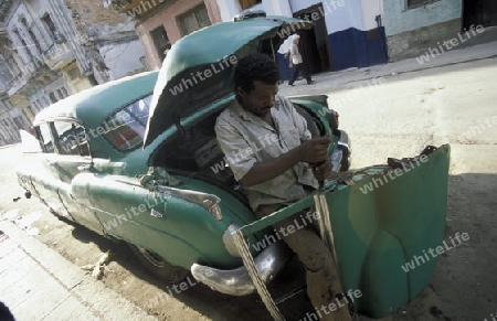 old cars in the old townl of the city of Havana on Cuba in the caribbean sea.