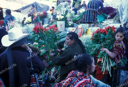 people in traditional clotes at the Market in the Village of  Chichi or Chichicastenango in Guatemala in central America.   