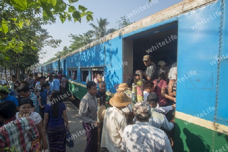 a train of the Yangon circle train in a trainstation near the City of Yangon in Myanmar in Southeastasia.