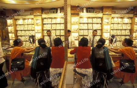 a Gold shop the souq or Market in the old town in the city of Dubai in the Arab Emirates in the Gulf of Arabia.