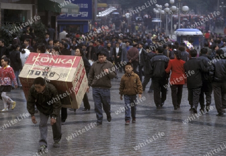 Transport people at the main square in the city of Chongqing in the province of Sichuan in china in east asia. 