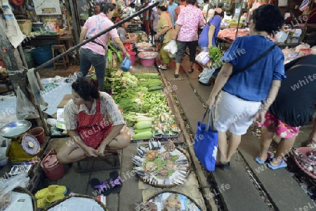 the Maeklong Railway Markt at the Maeklong railway station  near the city of Bangkok in Thailand in Suedostasien.