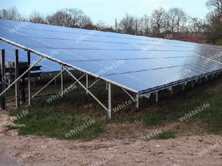 Generating clean energy with solar modules in a big park in northern Europe.