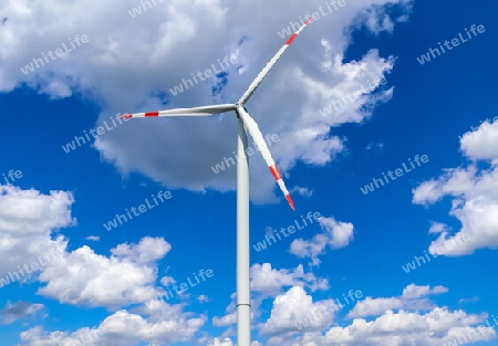 Panoramic view on alternative energy wind mills in a windpark