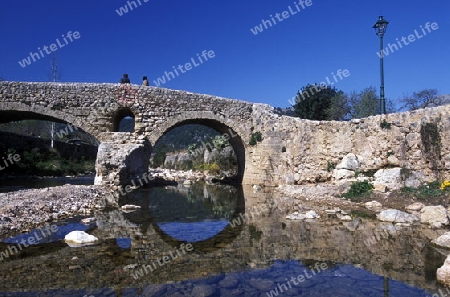 Eine alte Steinbruecke in Pollenca im osten  der Insel Mallorca im Mittelmeer in Spanien.