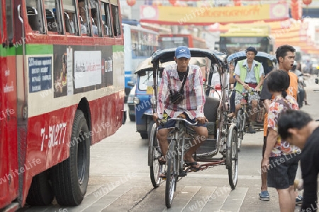 Bicycle Ricksha Taxis at the morning Market in Nothaburi in the north of city of Bangkok in Thailand in Southeastasia.