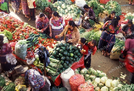 people in traditional clotes at the Market in the Village of  Chichi or Chichicastenango in Guatemala in central America.   