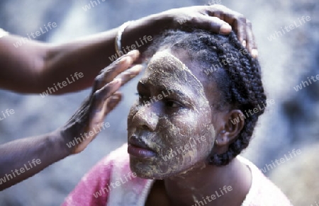 a women in the city of Moutsamudu on the Island of Anjouan on the Comoros Ilands in the Indian Ocean in Africa.   