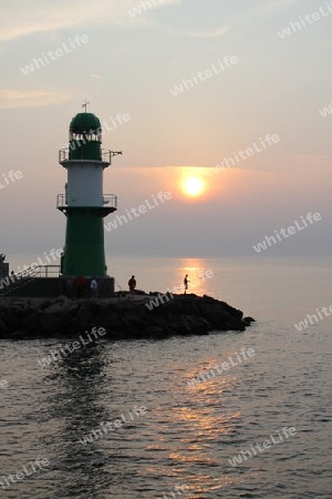 Angler im Sonnenuntergang