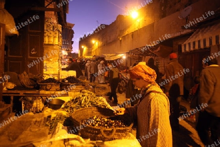 a smal Marketroad in the Medina of old City in the historical Town of Fes in Morocco in north Africa.