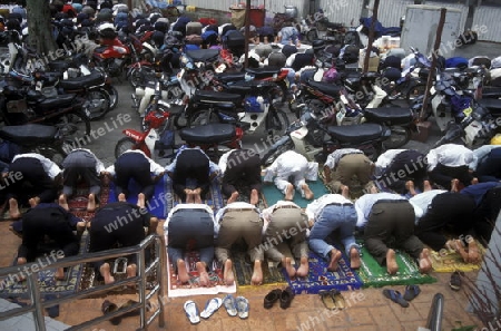 Muslim prayers at a Mosque in the city of  Kuala Lumpur in Malaysia in southeastasia.