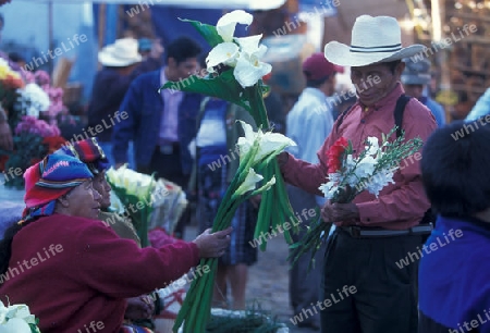 people in traditional clotes at the Market in the Village of  Chichi or Chichicastenango in Guatemala in central America.   