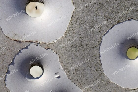 Detailed close up of bullet holes from gun shots in a german traffic sign