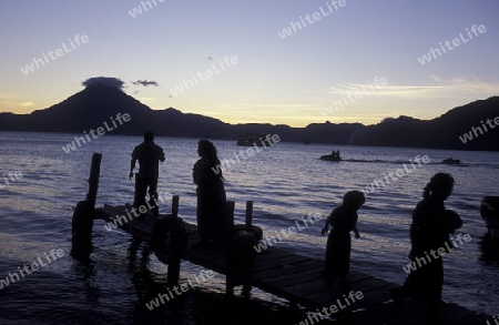 The Lake Atitlan mit the Volcanos of Toliman and San Pedro in the back at the Town of Panajachel in Guatemala in central America.   