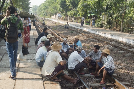 a train of the Yangon circle train in a trainstation near the City of Yangon in Myanmar in Southeastasia.