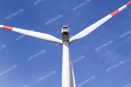 View on alternative energy wind mills against the sky