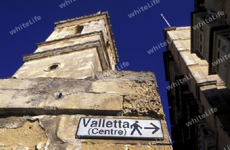 A smal road in the centre of the Old Town of the city of Valletta on the Island of Malta in the Mediterranean Sea in Europe.
