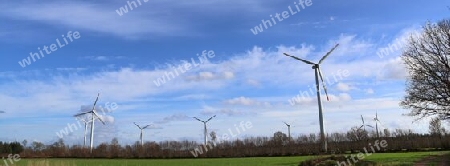 Panoramic view on alternative energy wind mills in a windpark